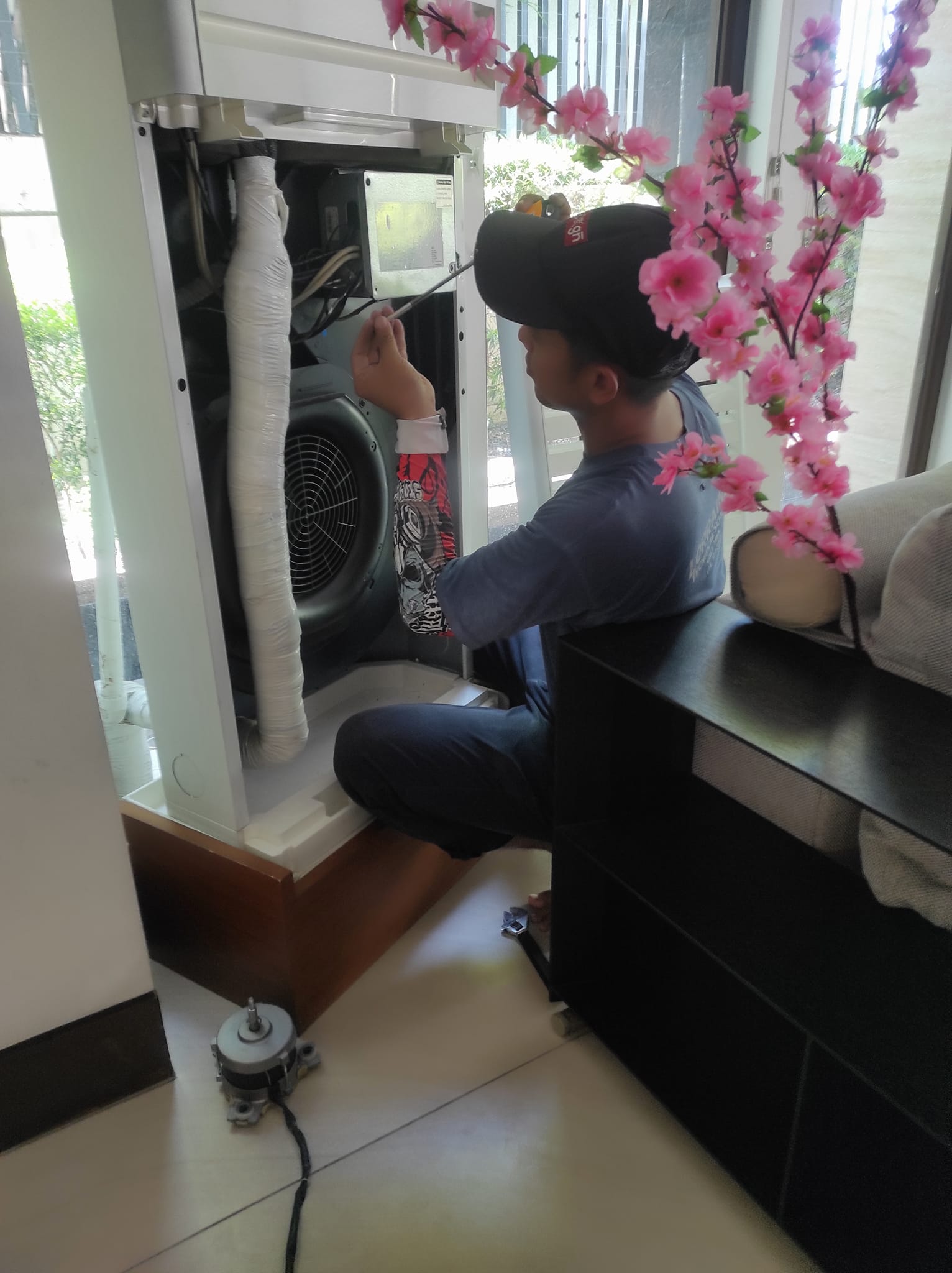 AC Technician performing service